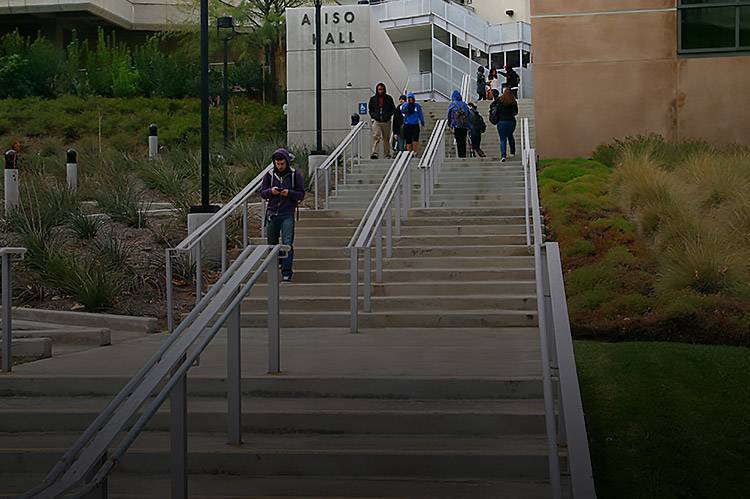 Students walking up the stairs to Aliso Hall