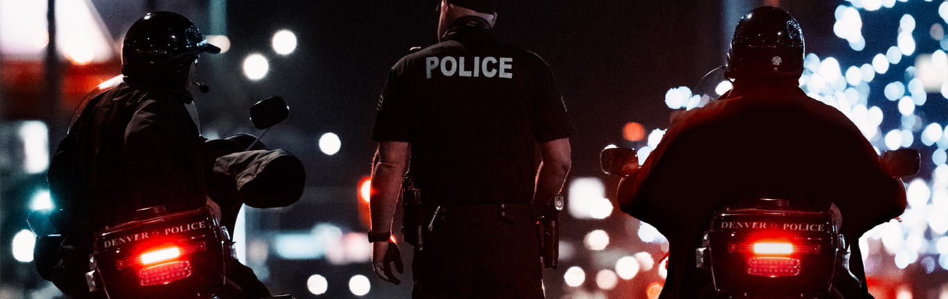 Motorcycle police at night.