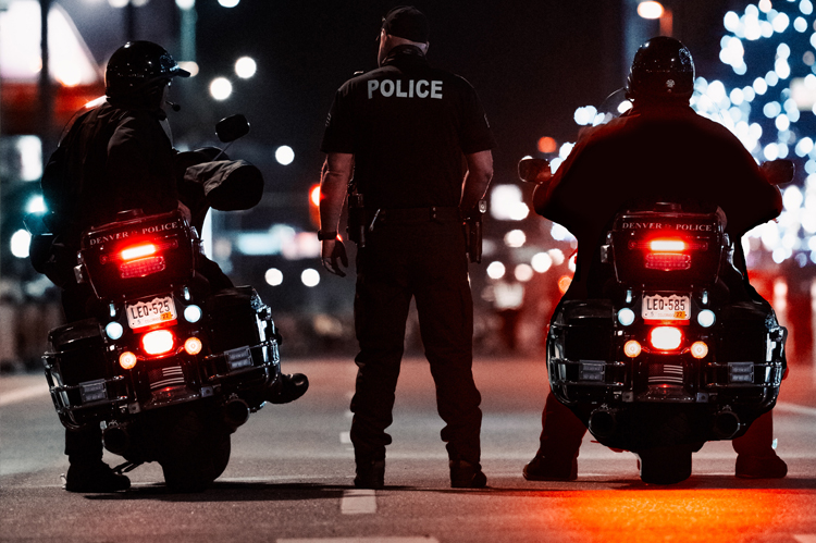 Motorcycle police at night.