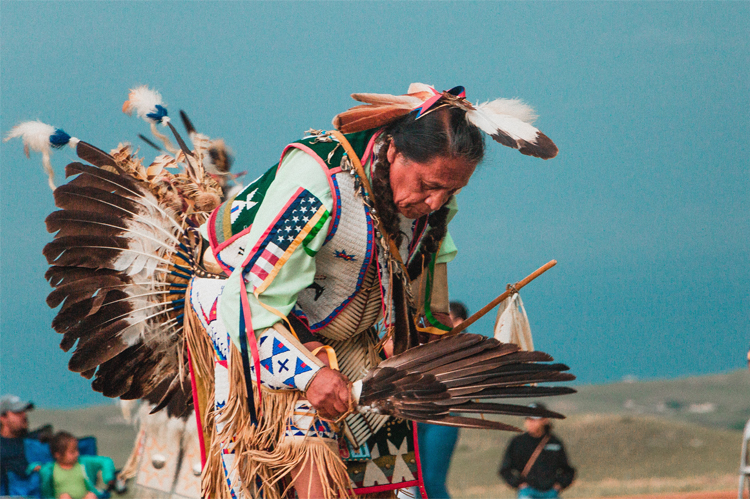 Tribal Indian Man dancing in cultural garments.